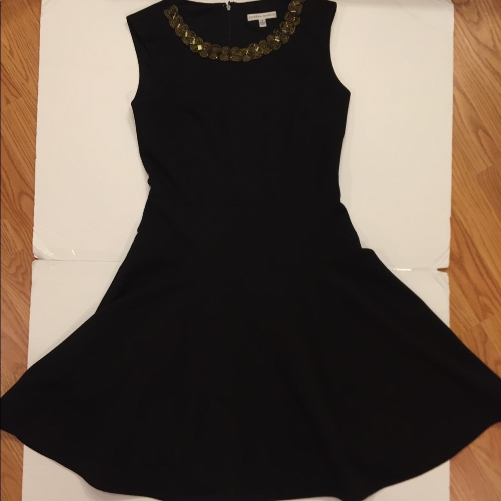Black dress with gold embellishment on neck