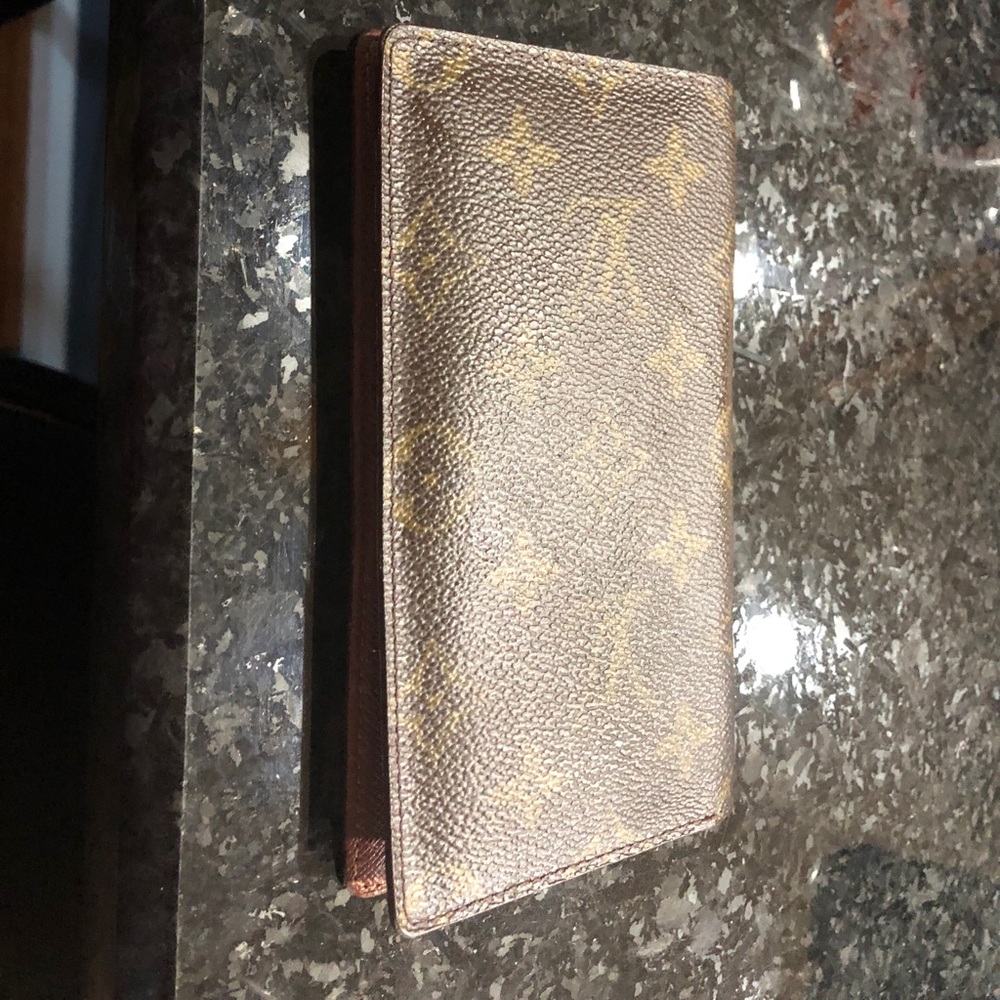 Louis Vuitton Authentic Monogram checkbooks.