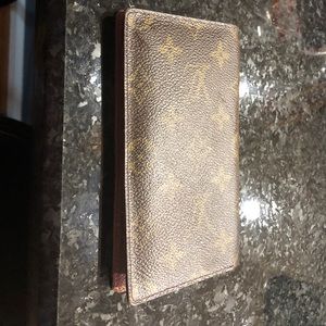 Louis Vuitton Authentic Monogram checkbooks.