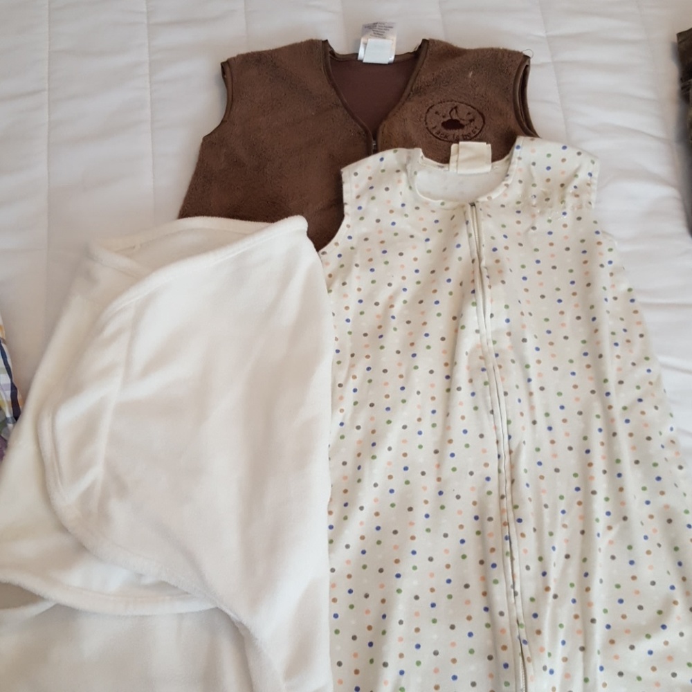 Two sleep sacks and one swaddle me wrap