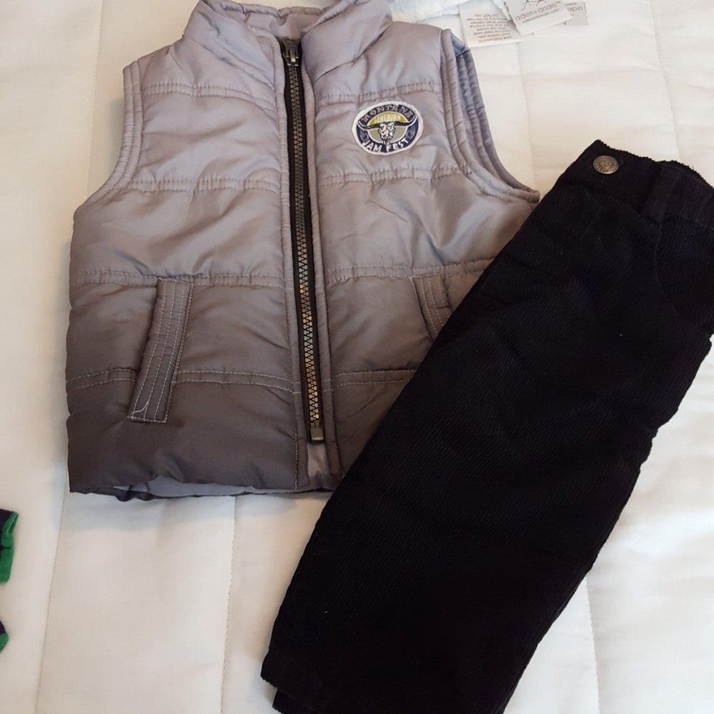Ombre puffer vest and black corduroy pants.