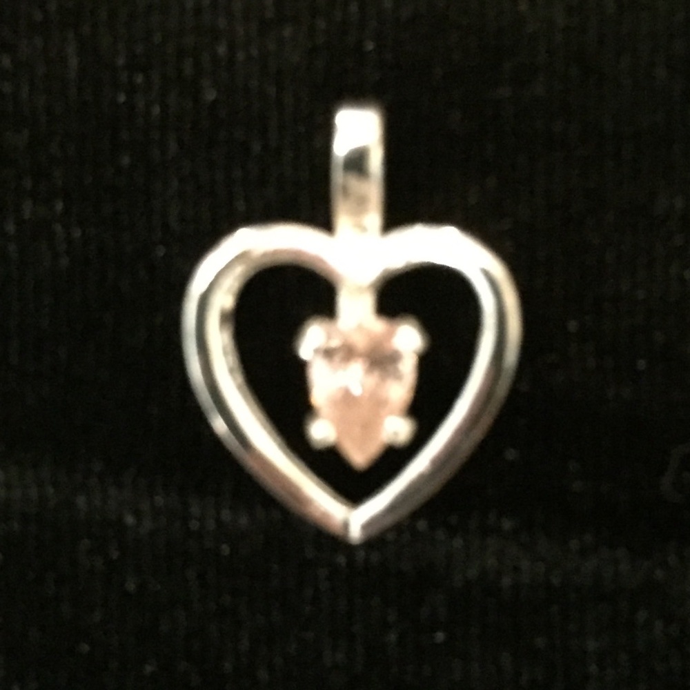 Sterling silver heart pendant with pink CZ stone.