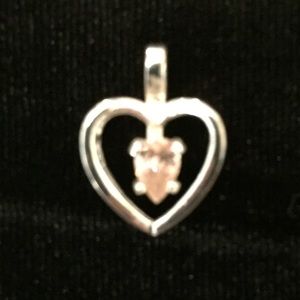 Sterling silver heart pendant with pink CZ stone.