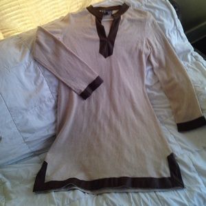 A creamy sweater dress with leather