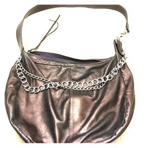 Boho meets rock-n-roll with this crossly-body bag!