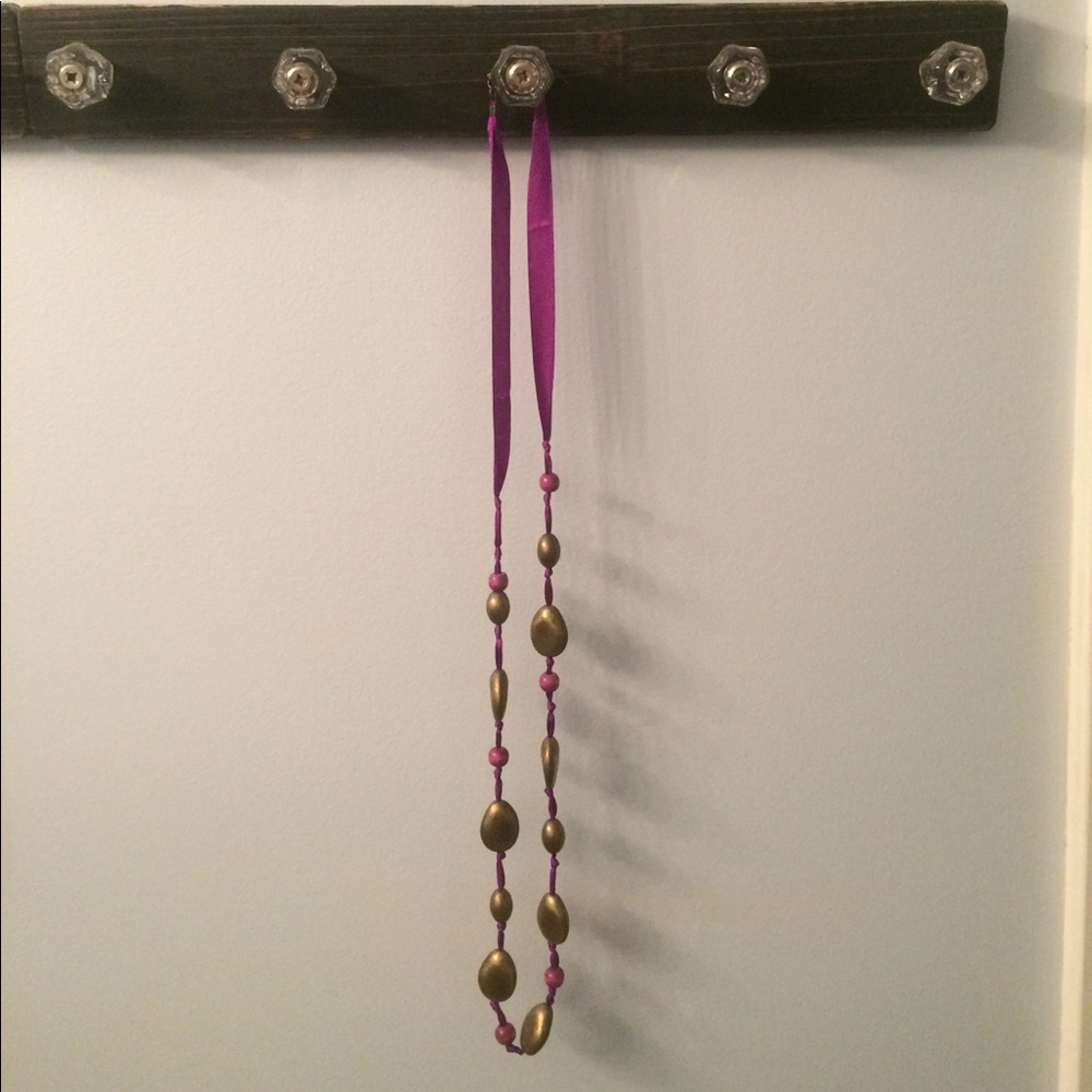 Purple necklace with gold beads