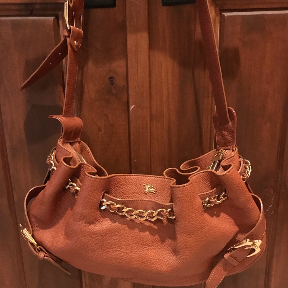 Burberry orange/tan handbag.