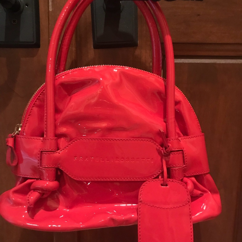 Fratelli Rossetti Italian melon colored handbag.