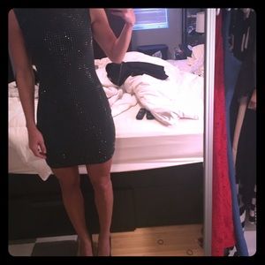 Form fitted green mini with gold metal sparkle!