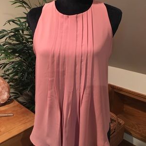 Blush sleeveless, swingy blouse