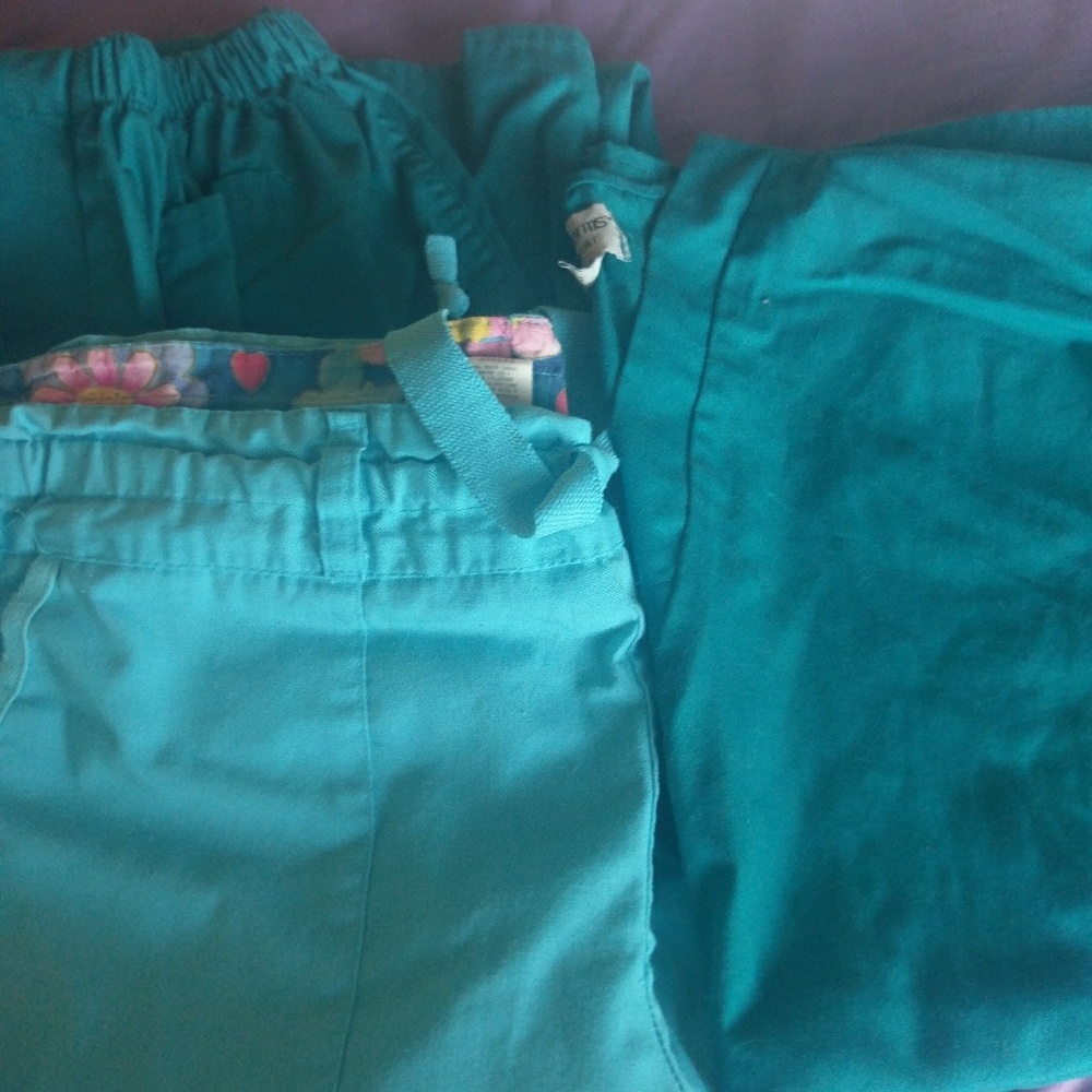 2 pairs of scrub pants and 1 shirt