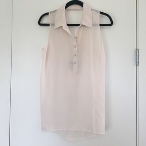 Cream sleeveless top with gold buttons