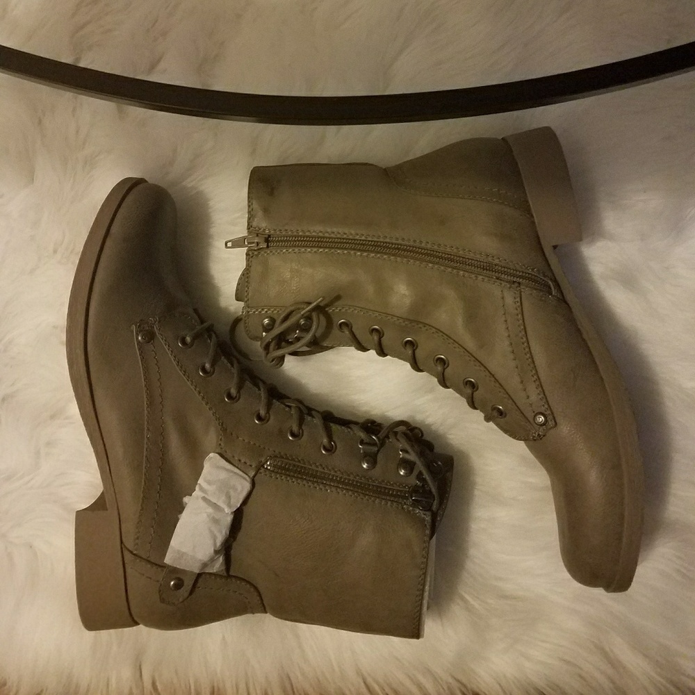 New boots. (Tiny stain on inner side of 1)