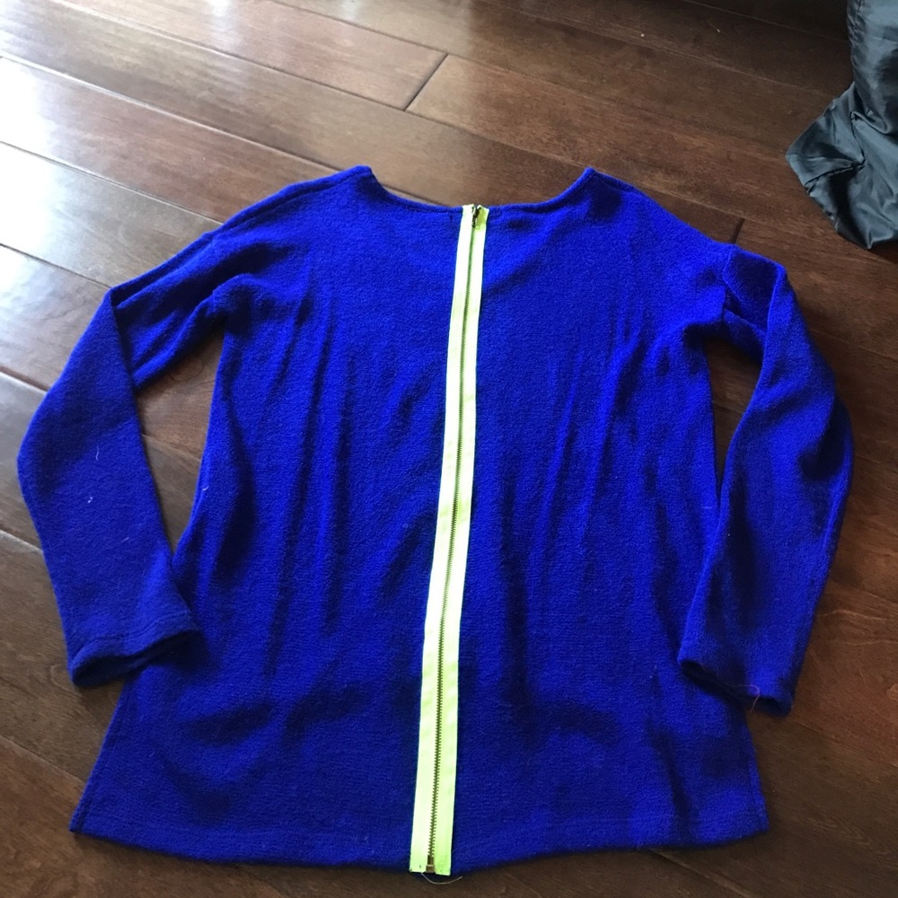 Blue sweater with lime green zipper