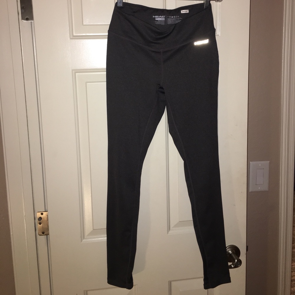 Gray track pants with cut outs on the heel