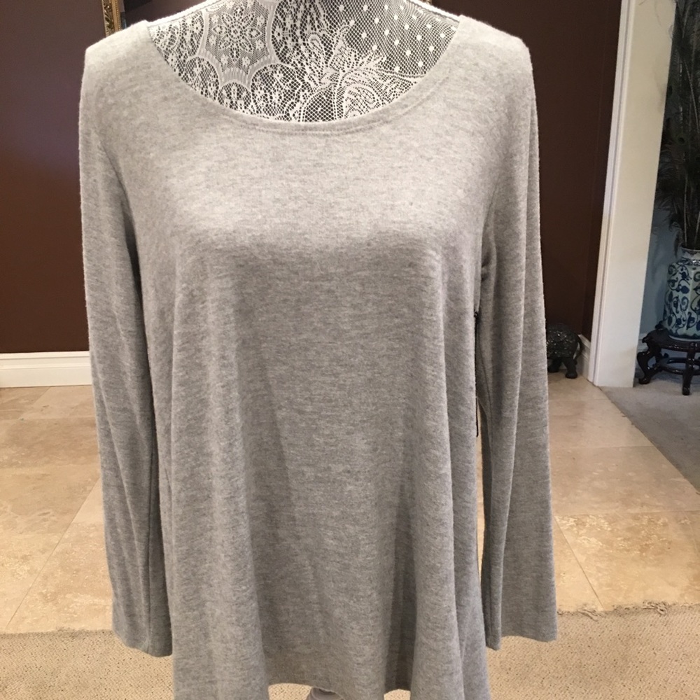Hye Park and Lune Sweater with open back.