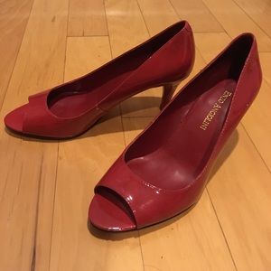Red patent peeptoe pumps