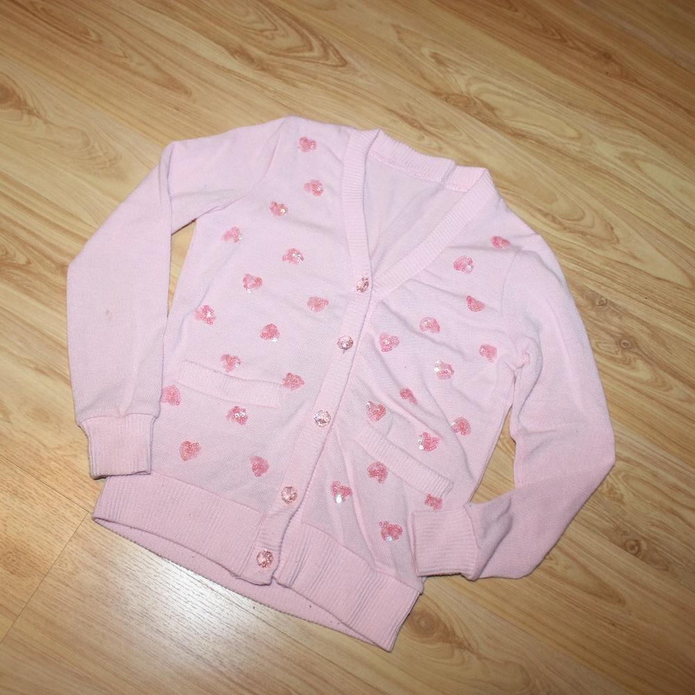 SOLD.  Pink cardigan with hearts