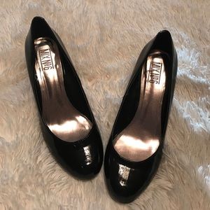 Faux patent high heel dress shoe.