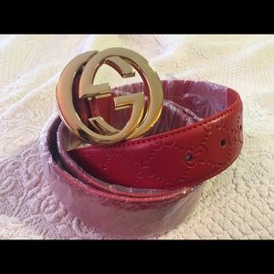 Red Gucci with gold buckle belt size. 36. 38