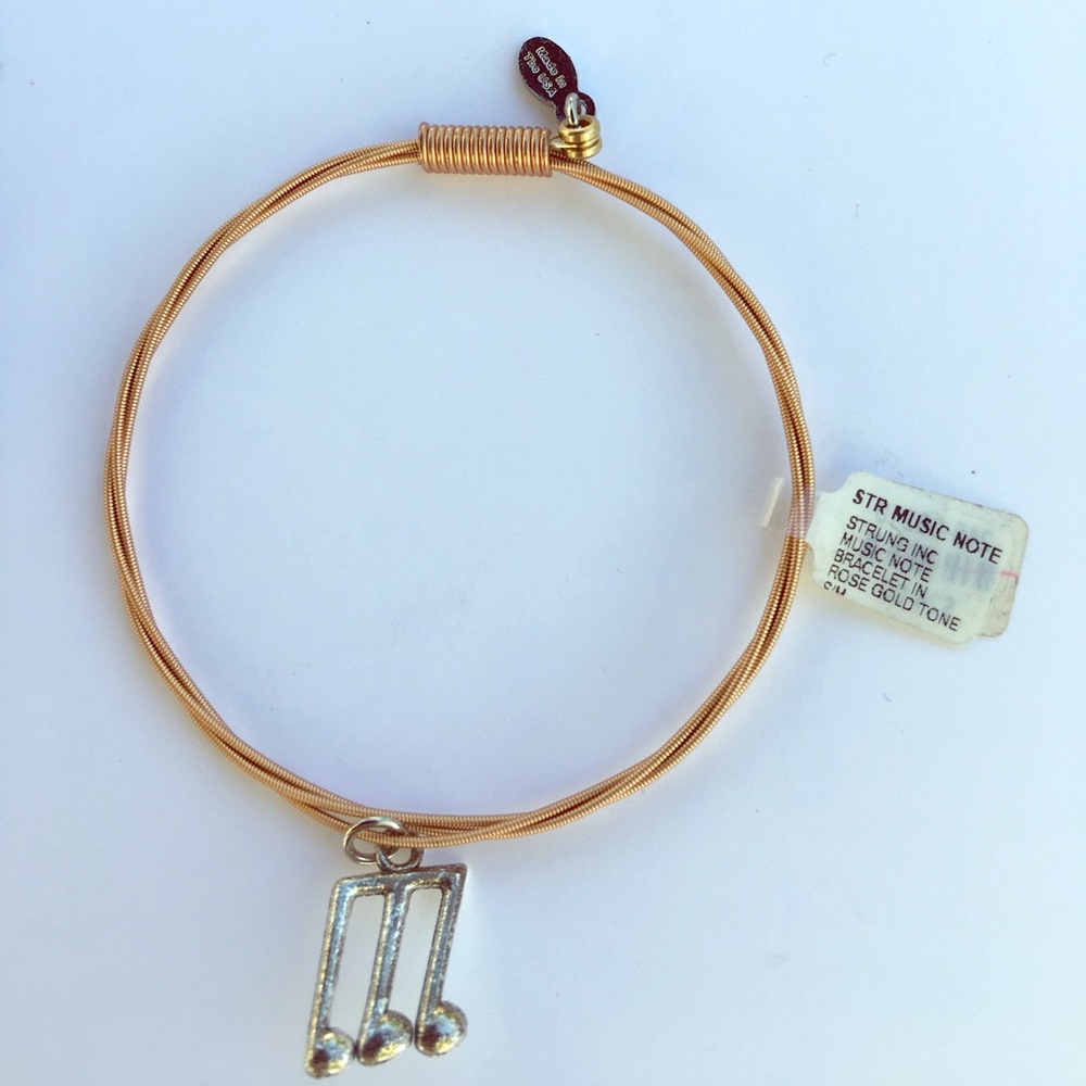 Strung inc music note bracelet in rose gold tone