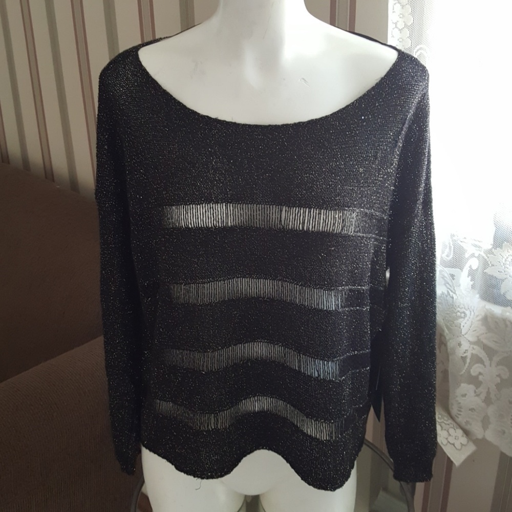 Beautiful sweater with see thru cut outs
