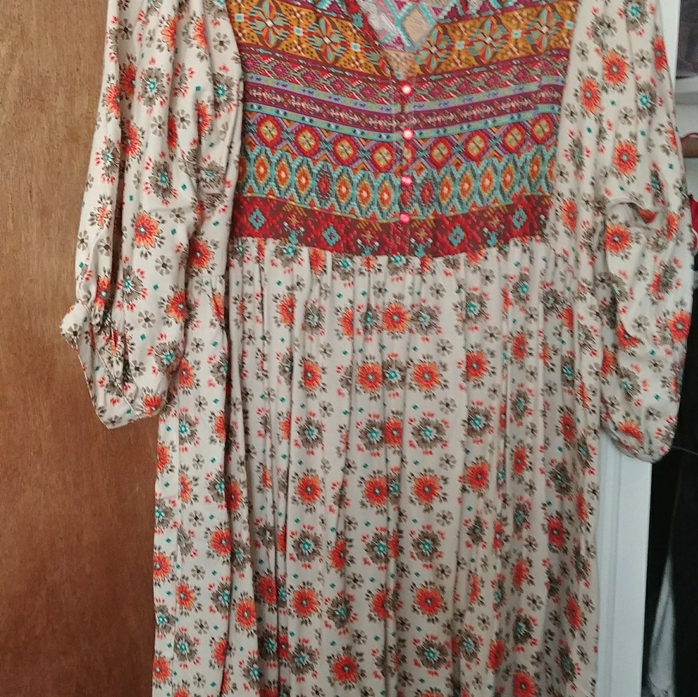 A selection of cover ups ..dresses and peasant top