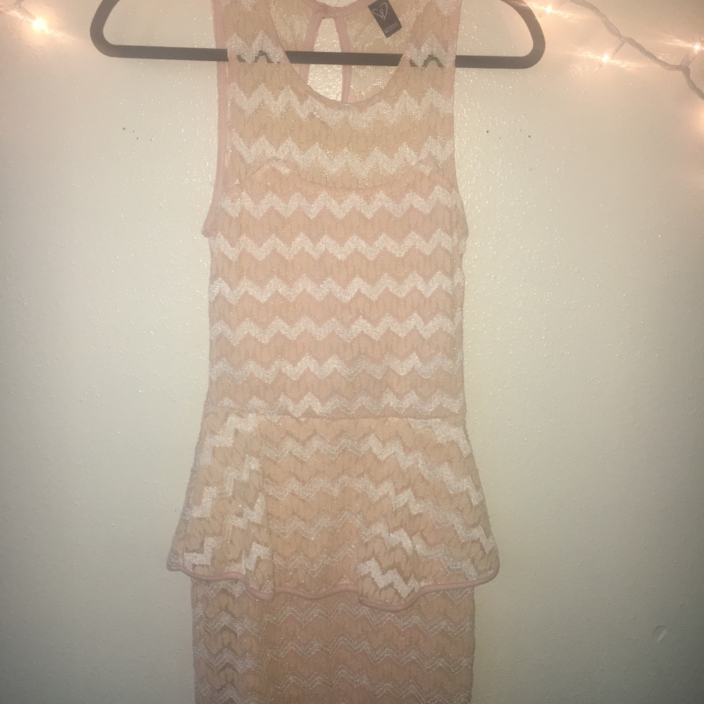 Peplum style dress with thick tank top straps.