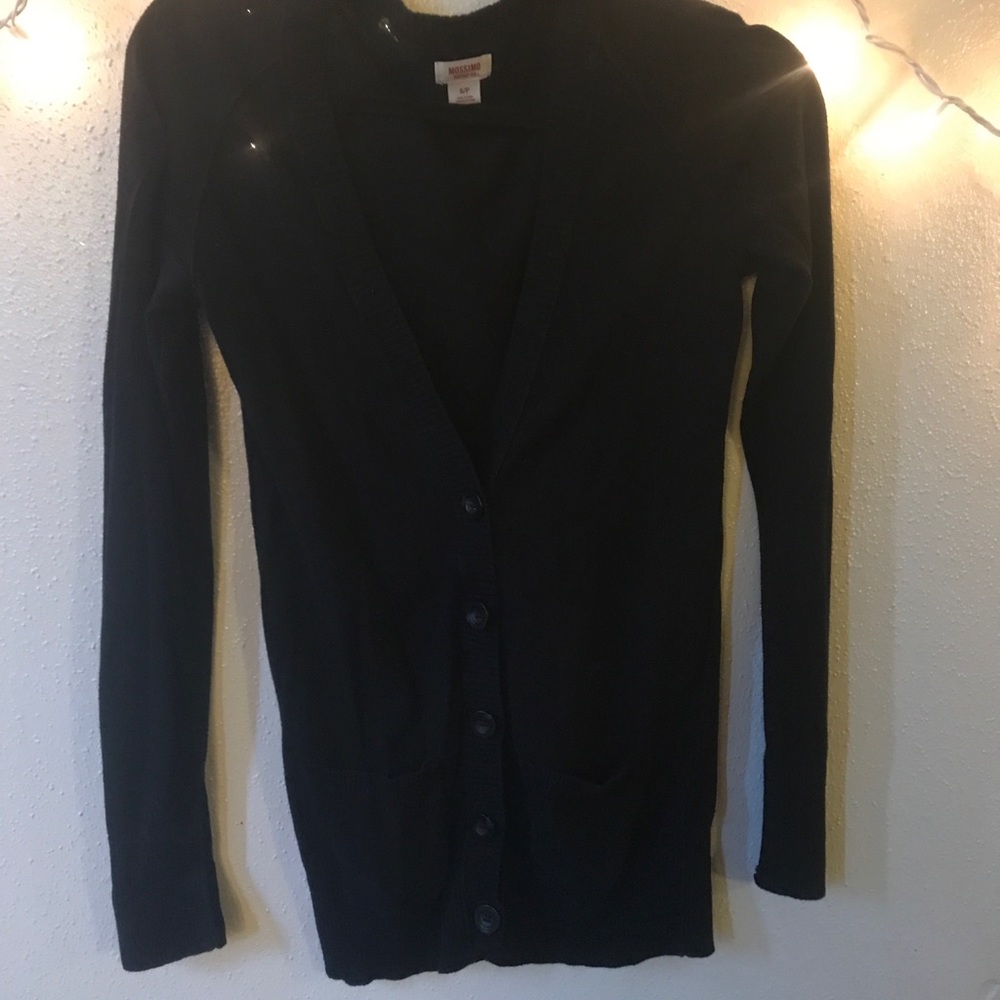 Black cardigan with pockets and black buttons.