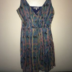 Brightly colored and designed V-necked dress