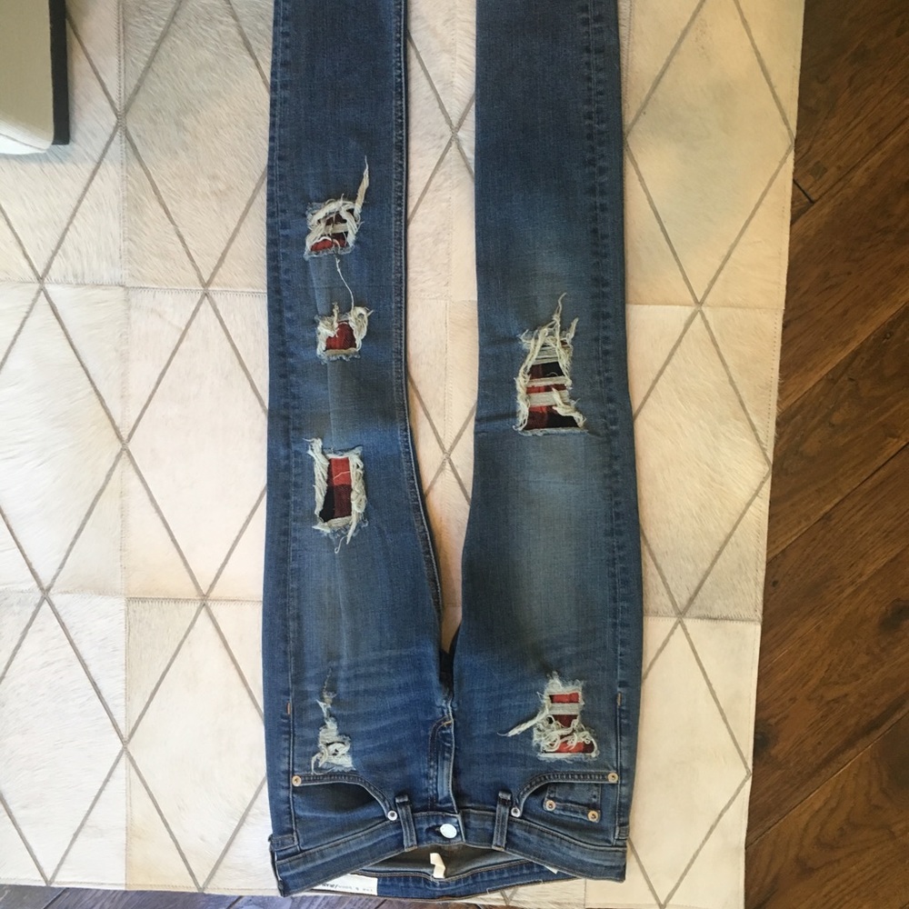 Distressed jeans with plaid cut outs