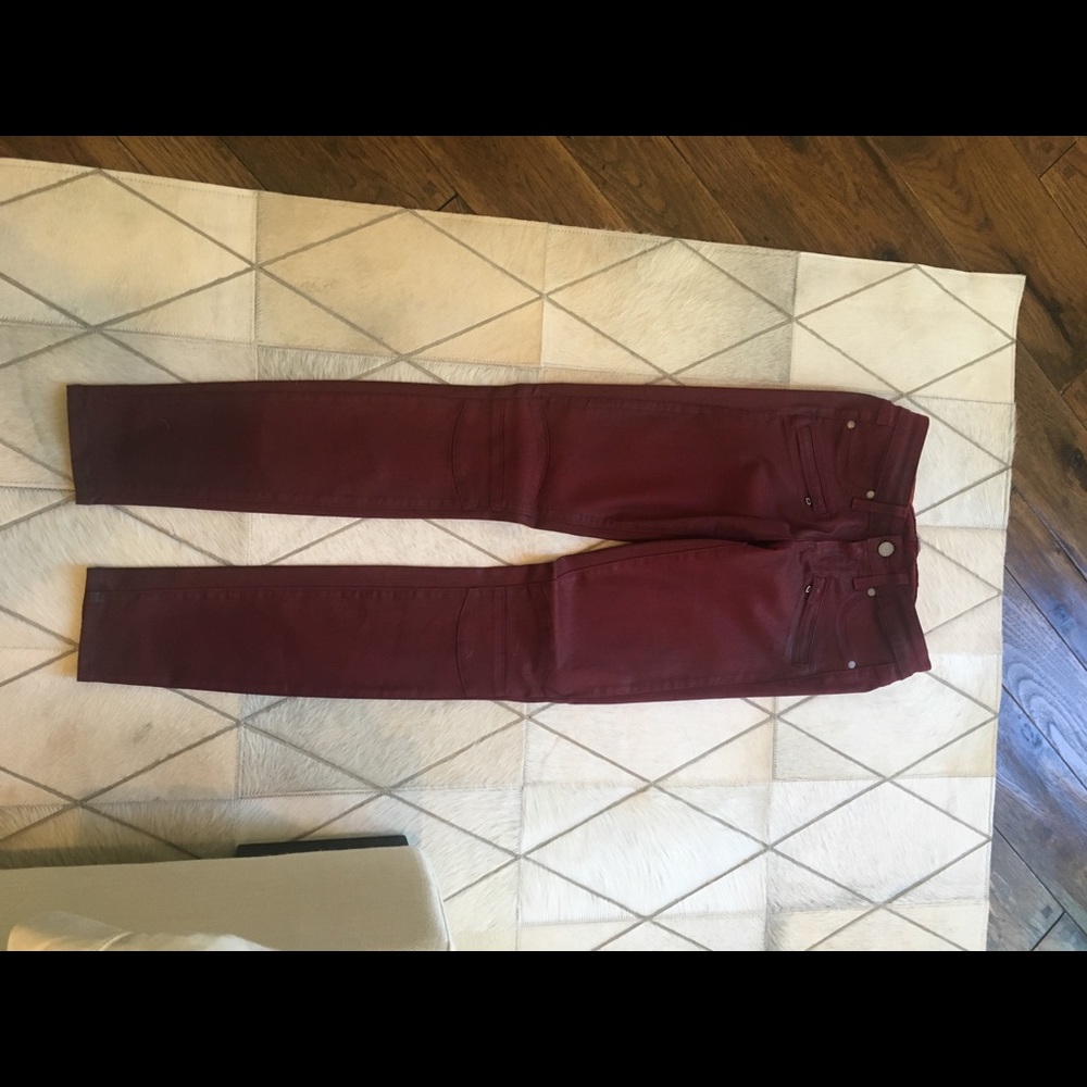 Wax coated burgundy jeans