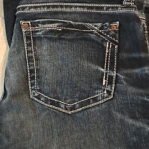 Buckle black boot cut jean