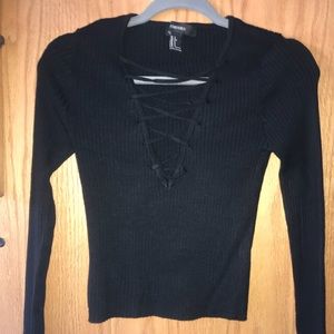 Black, long-sleeved shirt with laced-up bosom
