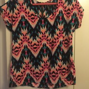 Multi-colored top with a zipper in the back