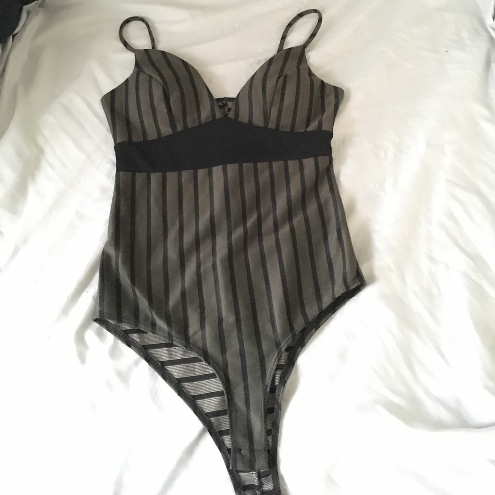 Stripped bodysuit. Never worn.