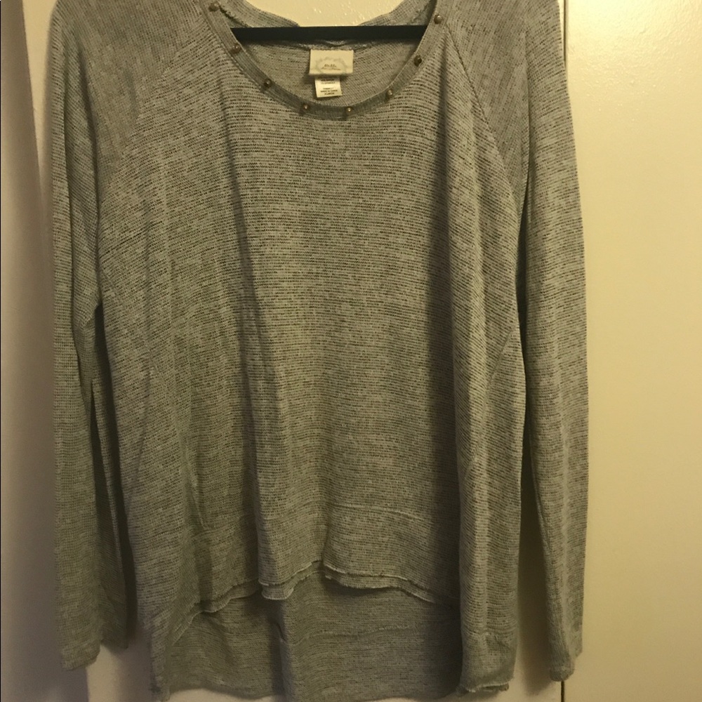 Gray sweater with gold studs around the neck