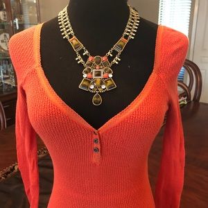 Free People orange long sleeve top size small.
