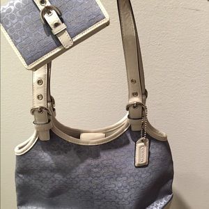 Coach small signature bag with matching wallet.