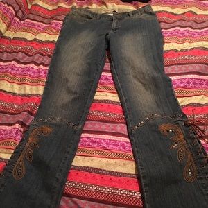 Retro jeans with embroidery on bottom with lacing.