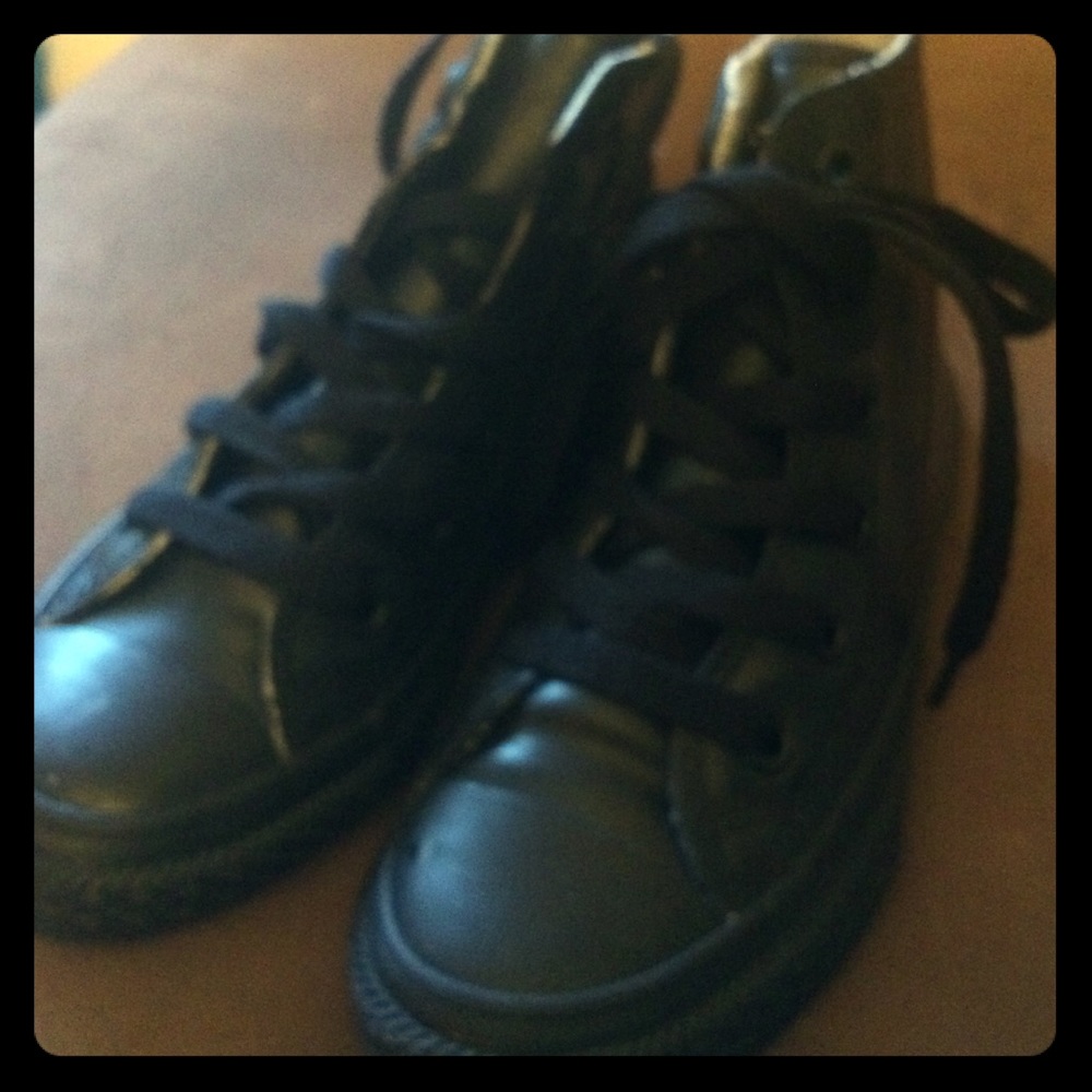 Converse or Chuck Taylor Leather high top sneakers