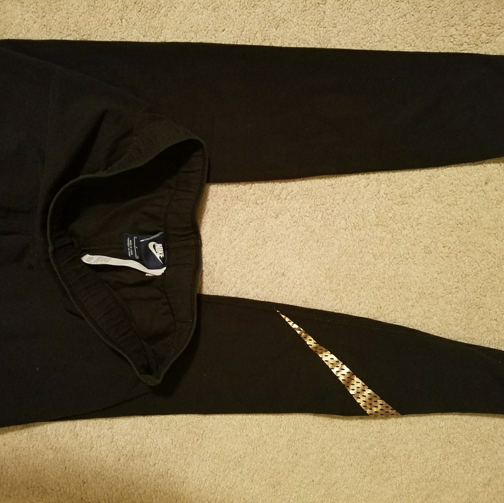 Gold swoosh NIKE leggings