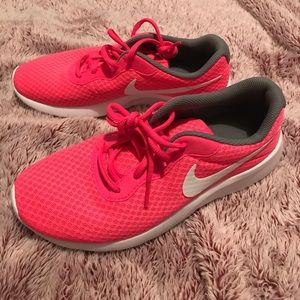 Hot pink Nike running shoes