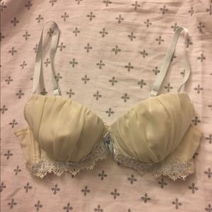 Pale yellow lingerie bra w/ light blue accents