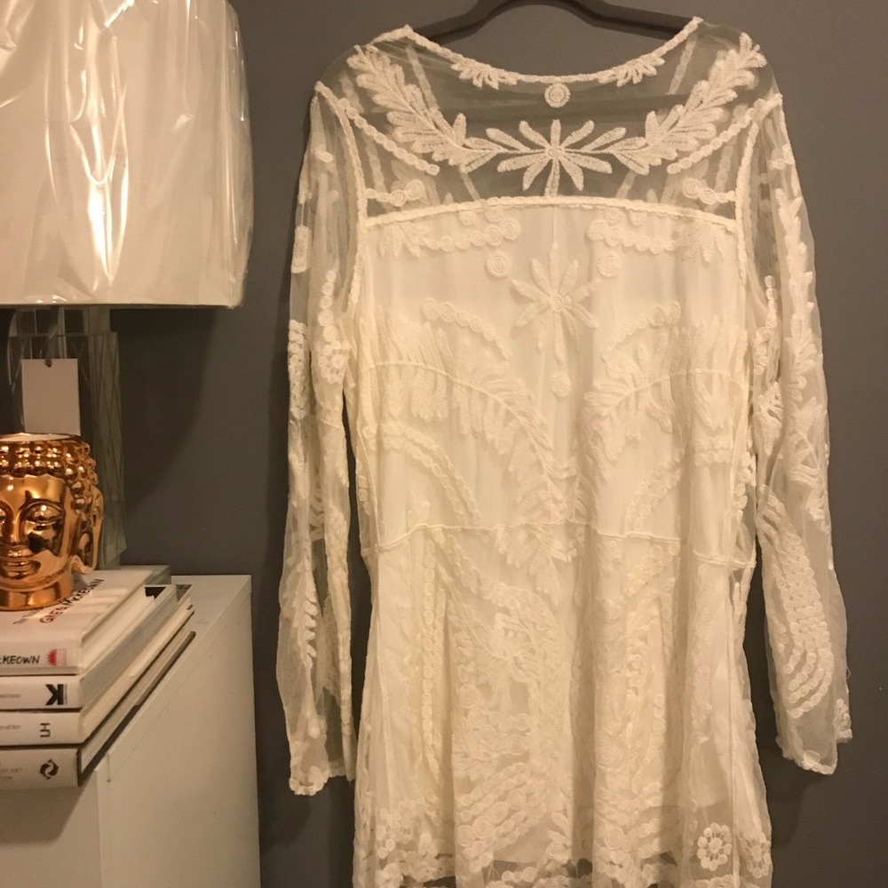 Lace or embroidered white dress