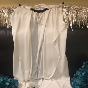 NWOT never worn long sleeveless blouse.