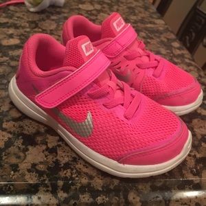 Hot pink Nike tennis shoes