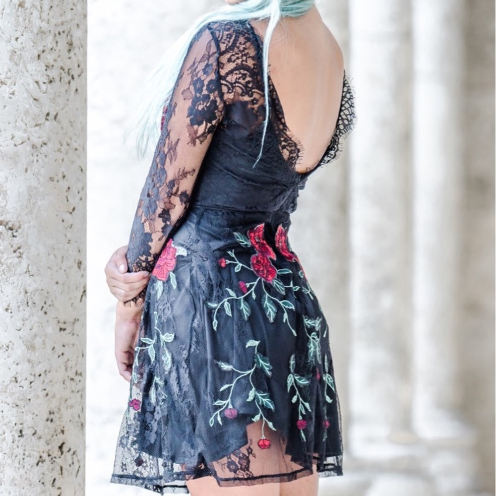 Black lace dress with rose appliqués