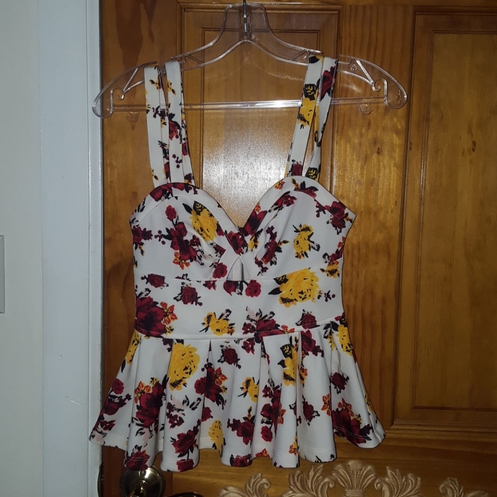 Floral printed peplum top. NWOT