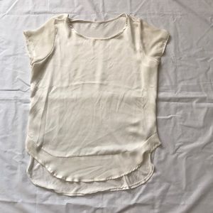 Cream colored tee shirt with satin feel